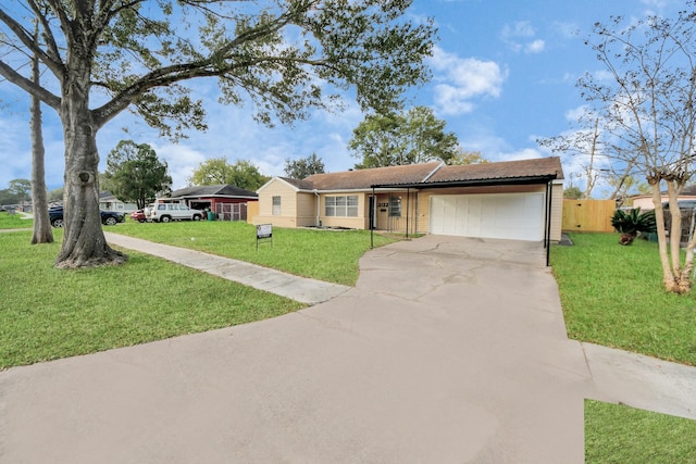 ranch-style home with a garage and a front lawn