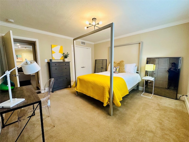 carpeted bedroom with ornamental molding, a textured ceiling, and a chandelier