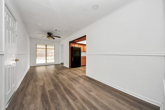 unfurnished living room with ceiling fan and dark hardwood / wood-style flooring