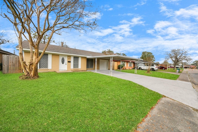 ranch-style house featuring a front yard and a carport