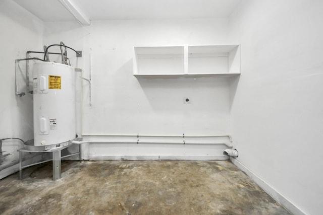 interior space featuring electric water heater and hookup for an electric dryer