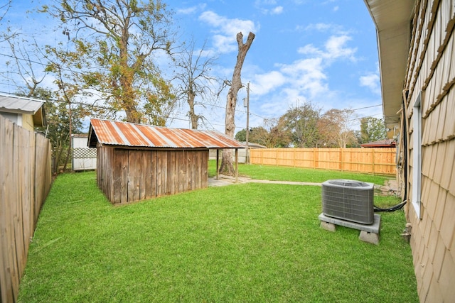 view of yard with a storage unit and cooling unit