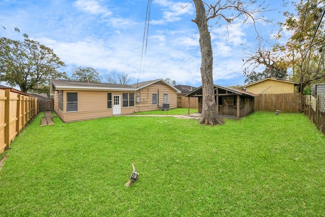 back of house featuring a lawn and cooling unit