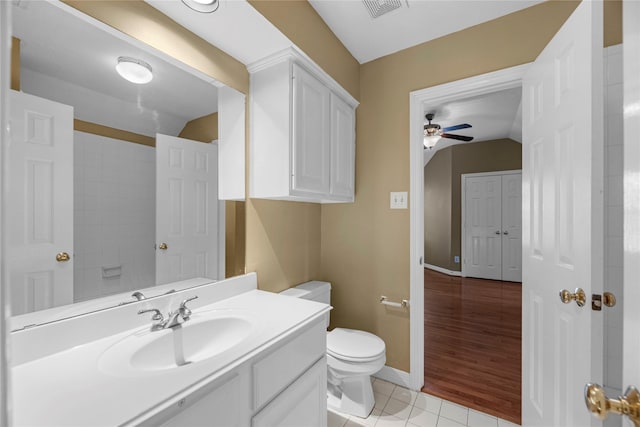 bathroom featuring toilet, vanity, tile patterned floors, and ceiling fan