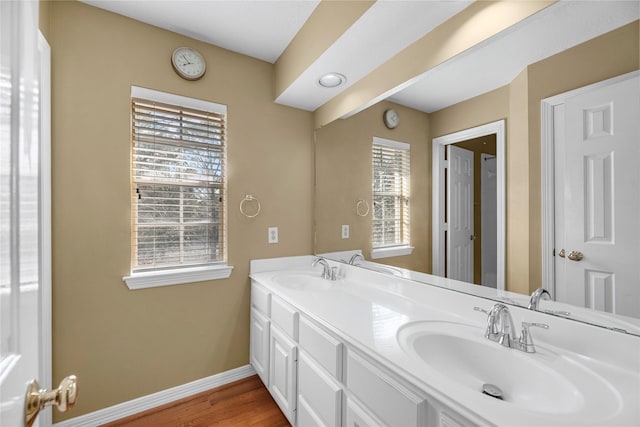 bathroom featuring hardwood / wood-style floors and vanity