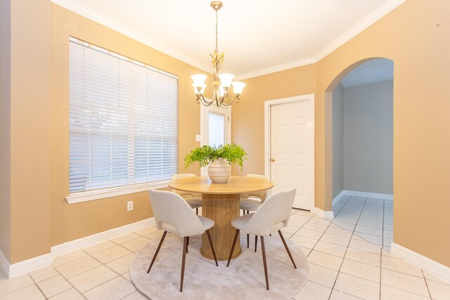 dining room featuring ornamental molding, light tile patterned floors, and a chandelier