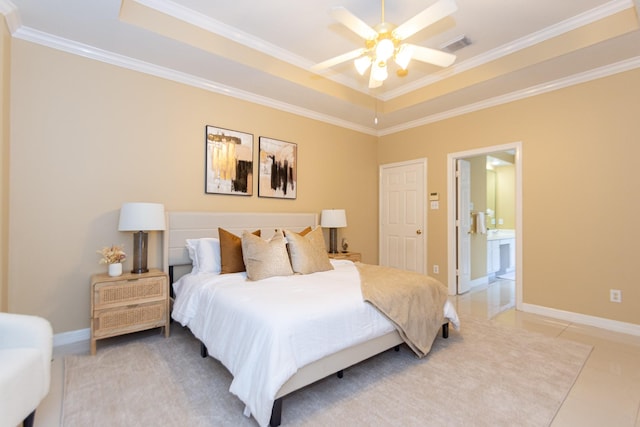 tiled bedroom featuring ensuite bathroom, a raised ceiling, ceiling fan, and ornamental molding