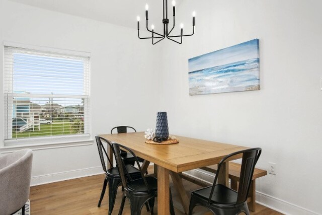 dining room featuring a chandelier and hardwood / wood-style floors