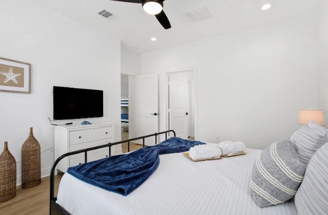 bedroom featuring light hardwood / wood-style floors and ceiling fan