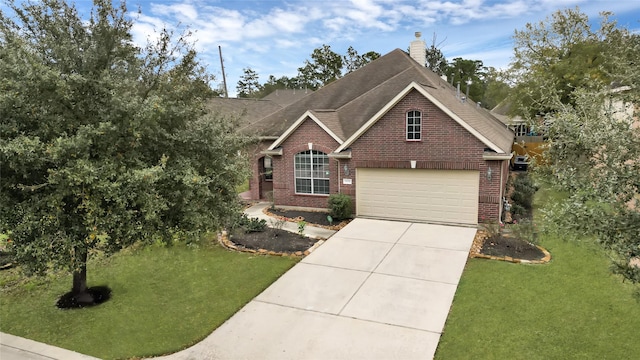 view of front facade with a front yard and a garage