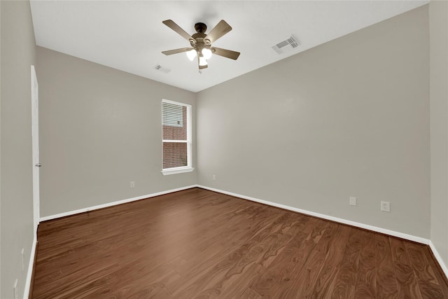 spare room featuring hardwood / wood-style flooring and ceiling fan