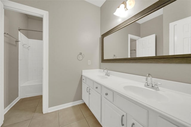 bathroom featuring tile patterned floors, vanity, and tiled shower / bath