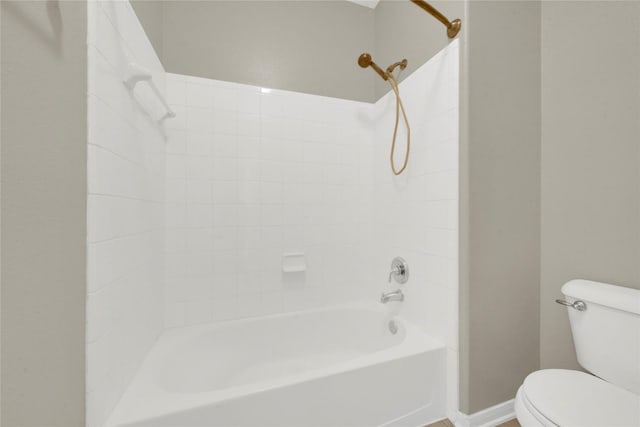 bathroom with toilet and shower / washtub combination