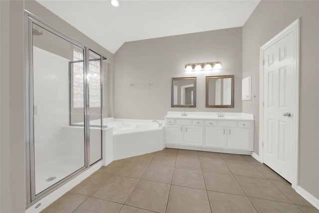 bathroom featuring vanity, tile patterned flooring, plus walk in shower, and vaulted ceiling