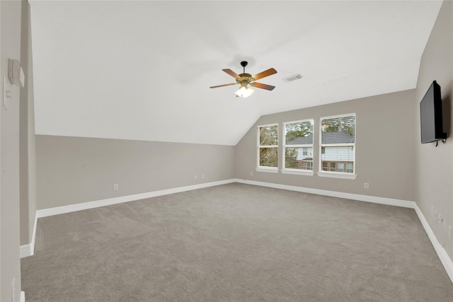 bonus room with carpet, ceiling fan, and lofted ceiling