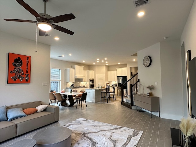 living room with ceiling fan