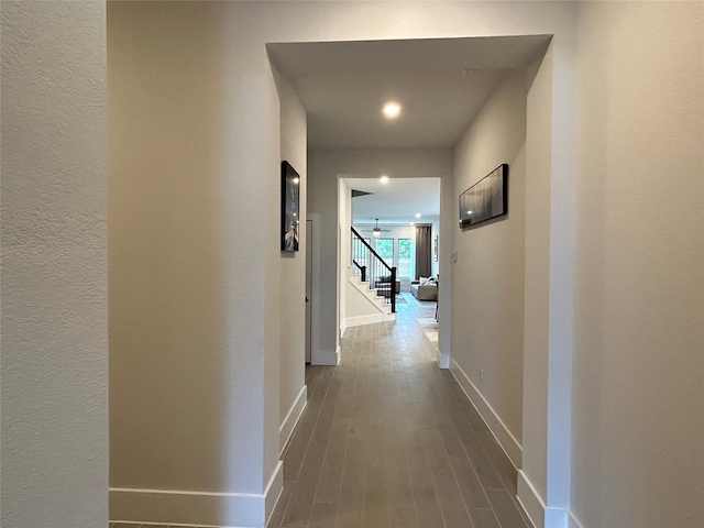 hallway with wood-type flooring