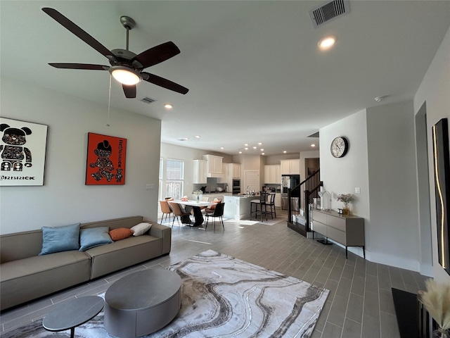 living room with ceiling fan