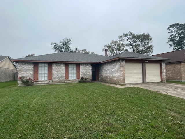 single story home featuring a front yard and a garage