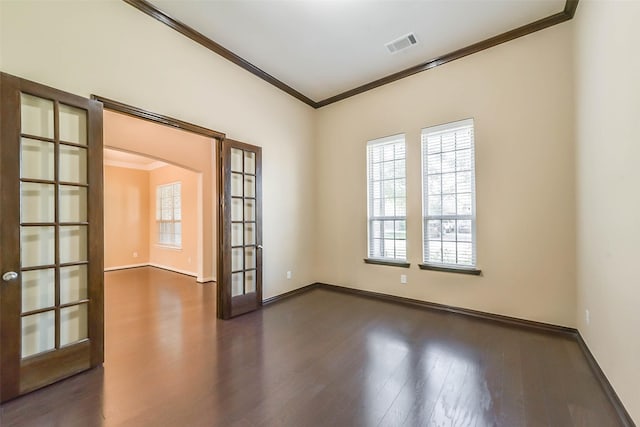 unfurnished room with french doors, dark wood-type flooring, and ornamental molding