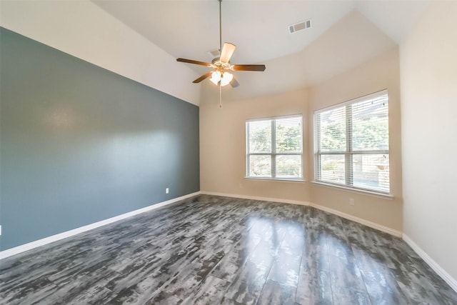 unfurnished room featuring ceiling fan, dark wood-type flooring, and vaulted ceiling