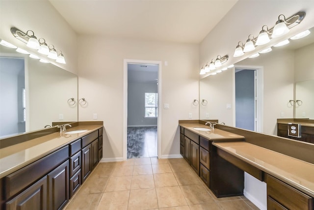 bathroom with tile patterned flooring and vanity