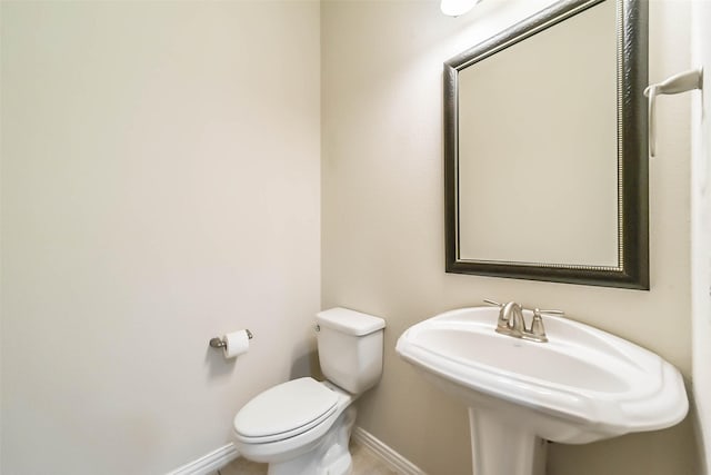 bathroom with toilet and sink