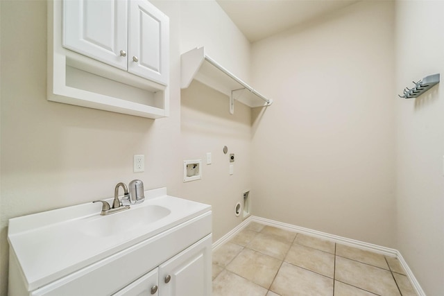 laundry area featuring sink, cabinets, hookup for an electric dryer, gas dryer hookup, and hookup for a washing machine