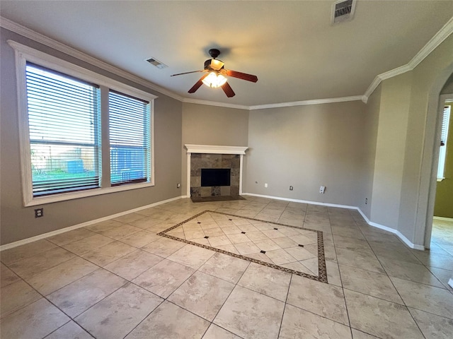 unfurnished living room featuring a fireplace, light tile patterned floors, and crown molding