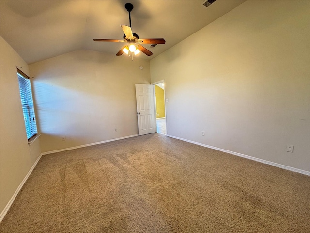 unfurnished bedroom featuring carpet flooring, ceiling fan, and vaulted ceiling