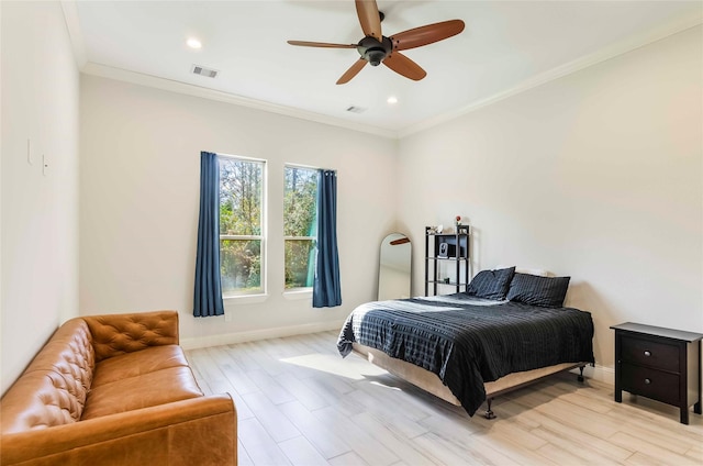 bedroom featuring ceiling fan, ornamental molding, and light hardwood / wood-style flooring