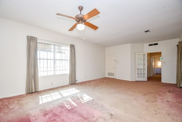 carpeted empty room with ceiling fan