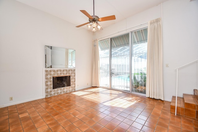 unfurnished living room featuring a tiled fireplace, ceiling fan, and light tile patterned floors