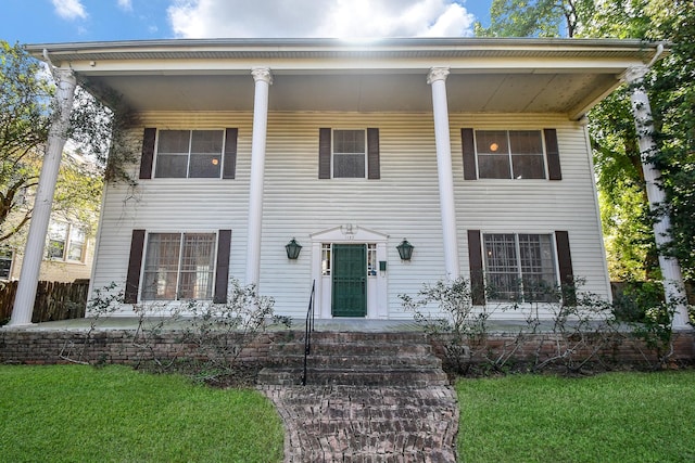 neoclassical home featuring covered porch