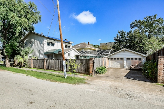 view of front property featuring an outdoor structure and a garage