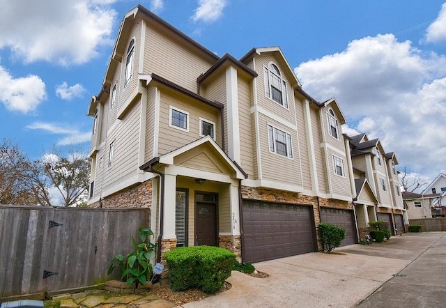 multi unit property featuring a garage