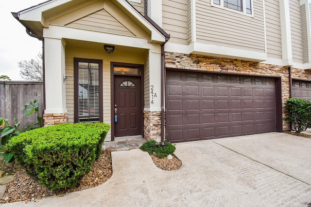 doorway to property featuring a garage