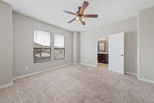 empty room with ceiling fan and light colored carpet