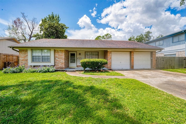 single story home with a front yard and a garage