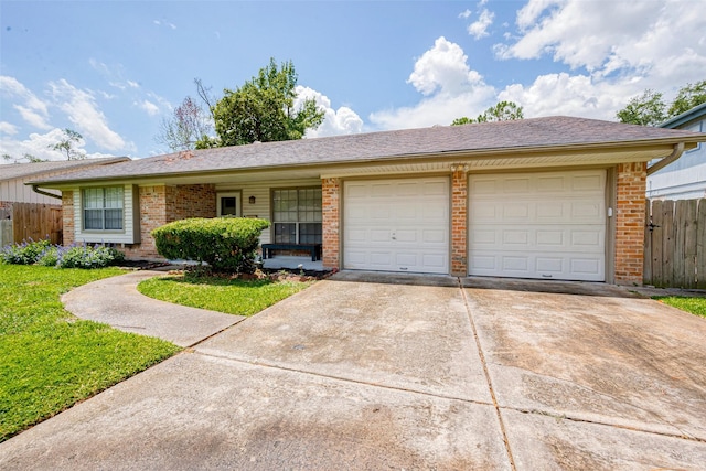 ranch-style home featuring a garage and a front lawn