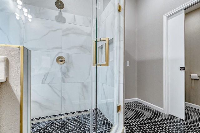 bathroom with a shower with shower door