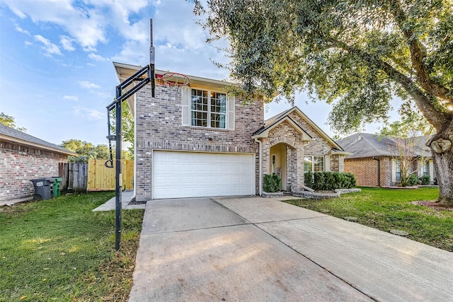 view of front of property featuring a garage and a front lawn