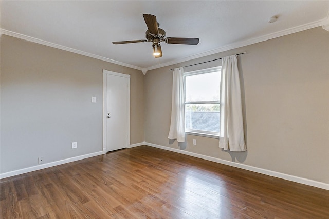 empty room with crown molding, ceiling fan, and hardwood / wood-style flooring