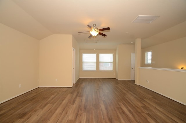 bonus room featuring ceiling fan, dark wood-type flooring, and lofted ceiling