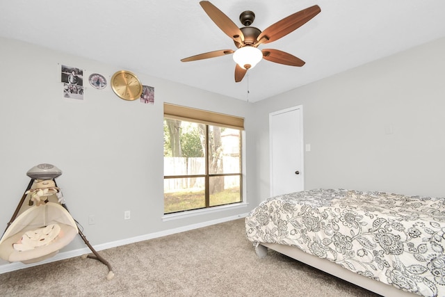 bedroom featuring multiple windows, ceiling fan, and carpet