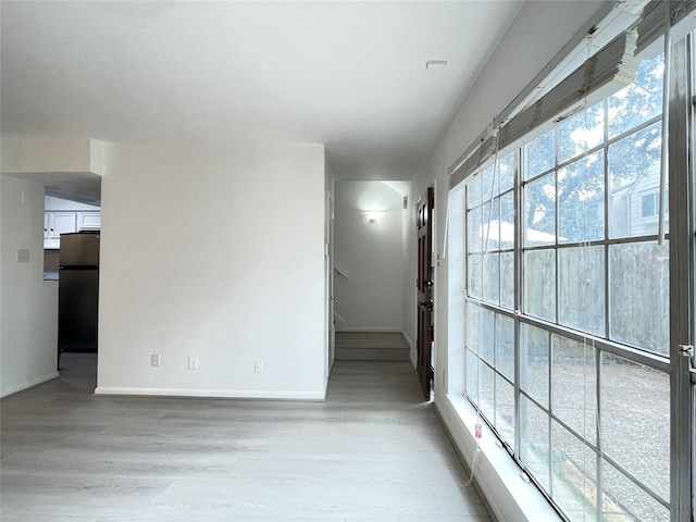 empty room with light wood-type flooring