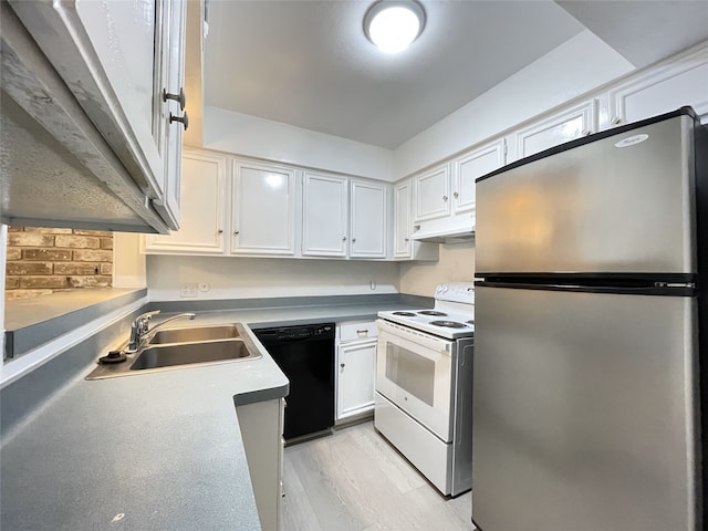 kitchen featuring dishwasher, stainless steel fridge, white electric stove, white cabinetry, and sink