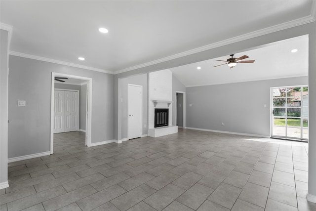 unfurnished living room featuring ceiling fan, crown molding, vaulted ceiling, a fireplace, and light tile patterned floors