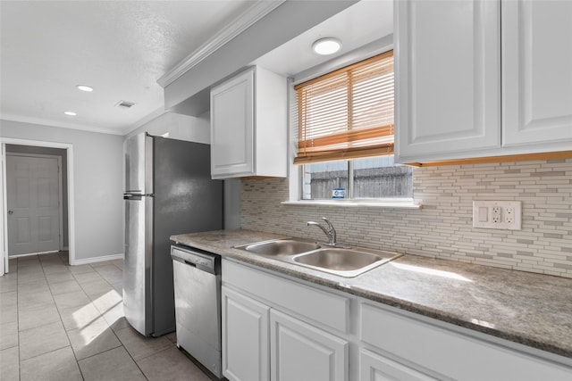 kitchen with dishwasher, white cabinetry, sink, and light tile patterned floors