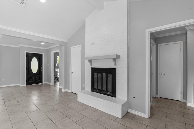 tiled entrance foyer featuring lofted ceiling with beams and a brick fireplace